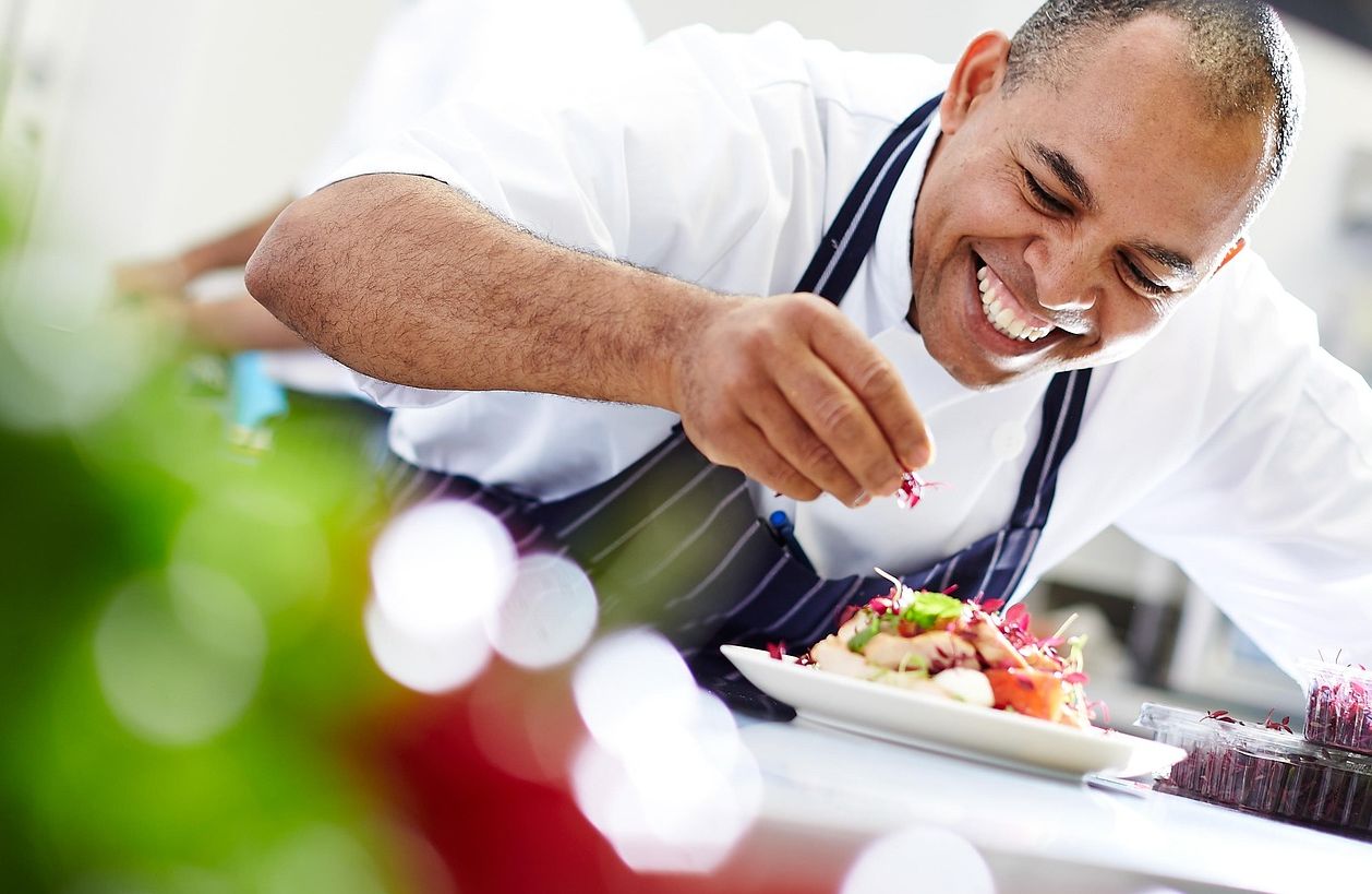 Happy, confident cook at work